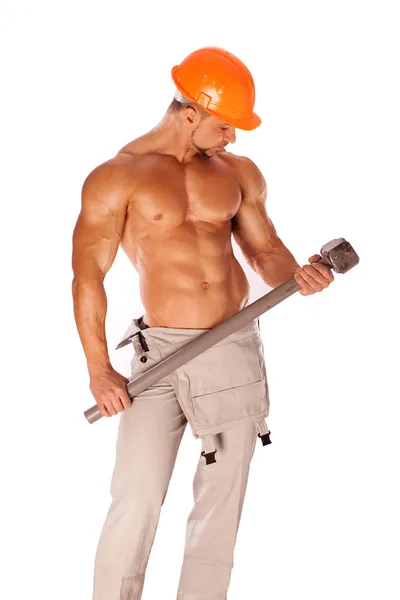 Handsome builder with a sledgehammer and sexy body — Stock Photo, Image