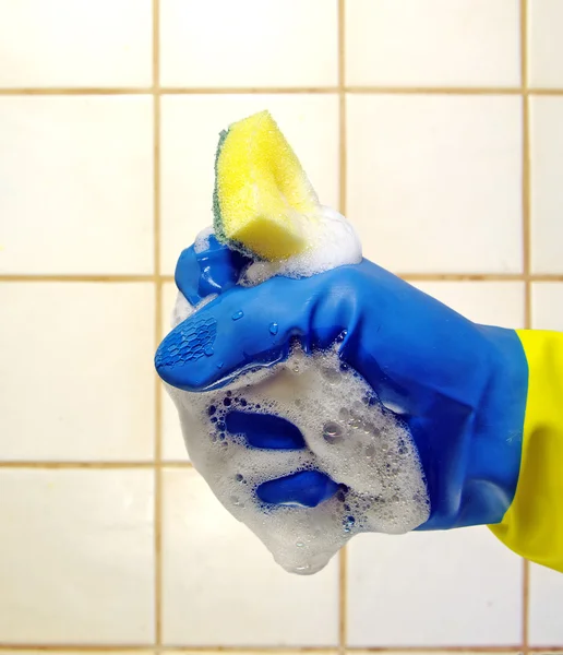 stock image Hand wearing a working glove and a sponge