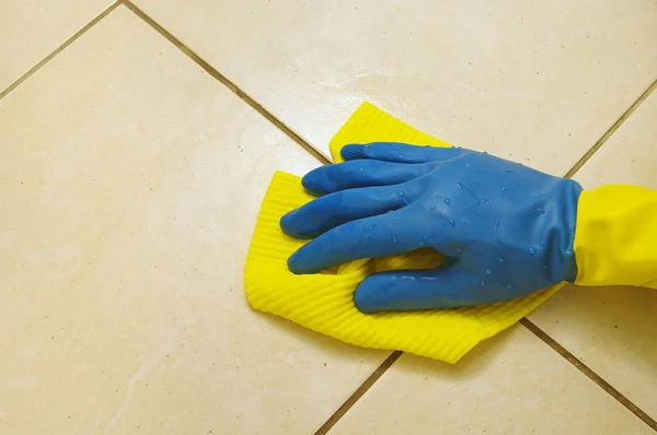 stock image Hand wearing a working glove and a sponge