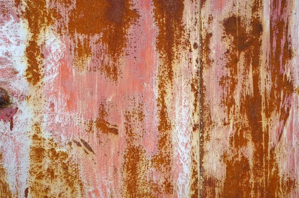 stock image Rusty door detail with color drop off