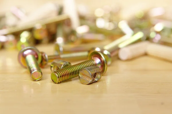 stock image Background with screw bolt on wooden floor. Construction equipme