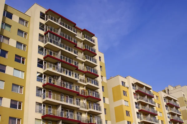 stock image Yellow apartment buildings in a blue sky background in Vilnius,