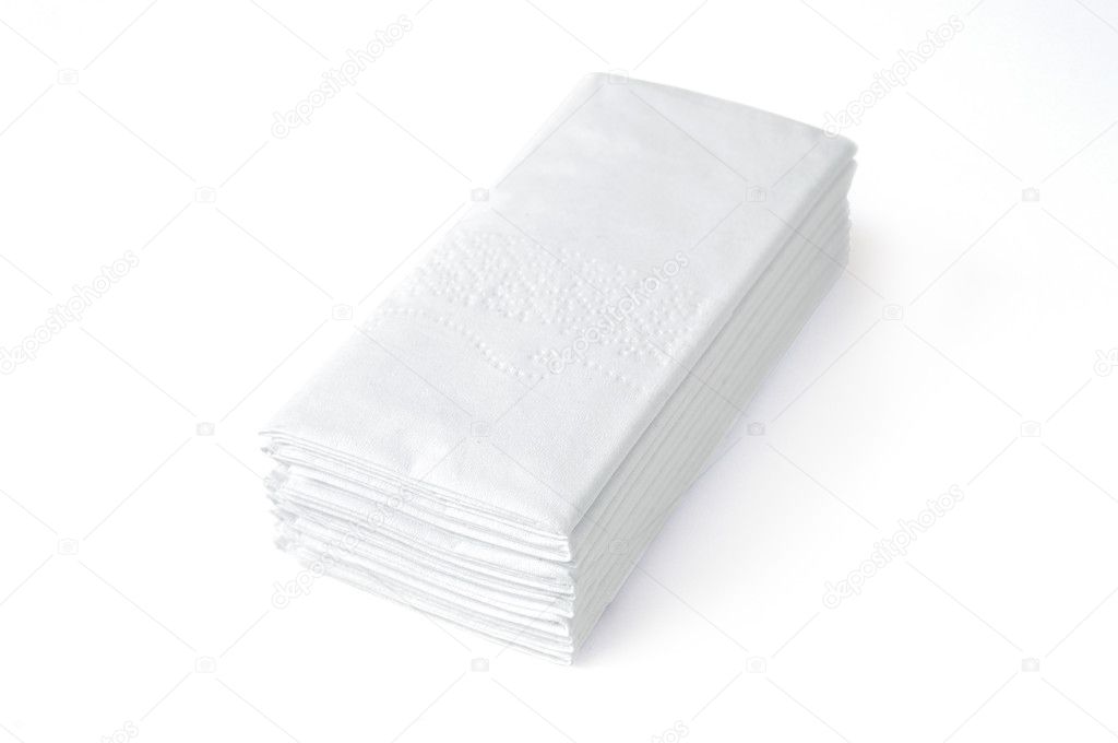 Stack of folded disposable tissue papers on white background