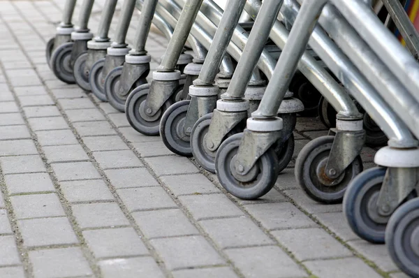 Old shopping carts wheels — Stock Photo, Image