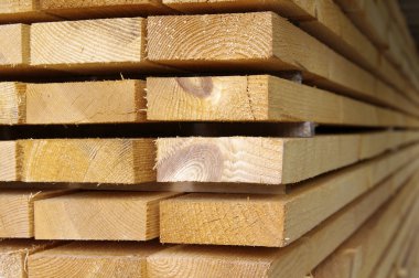 Close up view of stacked wooden boards clipart