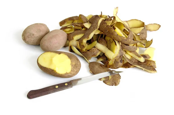 Potato, knife and potato peel isolated on the white background — Stock Photo, Image