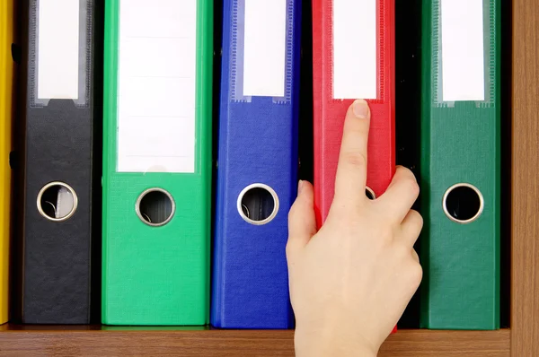 Folder with archival documents and a hand — Stock Photo, Image
