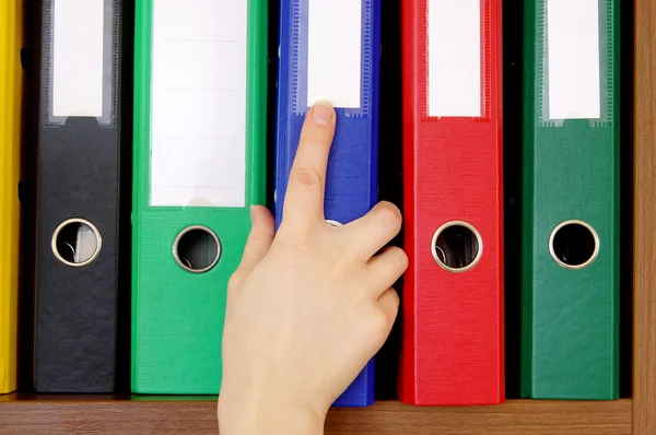 Folder with archival documents and a hand — Stock Photo, Image