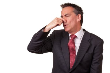 Business Man in Suit Smelling Something Bad clipart