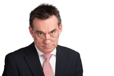 Stern Angry Business Man looking over glasses clipart