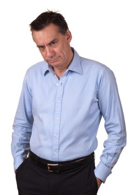 Angry Frowning Grumpy Man with Hands in Pockets clipart