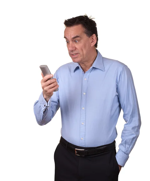 Homem atraente olhando para o telefone no horror — Fotografia de Stock