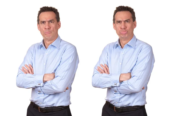 Uomo d'affari in camicia blu con espressione infelice scontroso due modi — Foto Stock