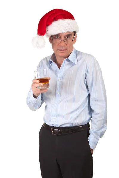 Leicht betrunkener Geschäftsmann mit Weihnachtsmann-Hut und Getränk — Stockfoto