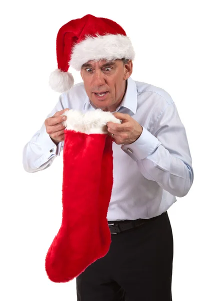 Business Man in Santa Hat Looking Surprised into Christmas Stocking — Stock Photo, Image