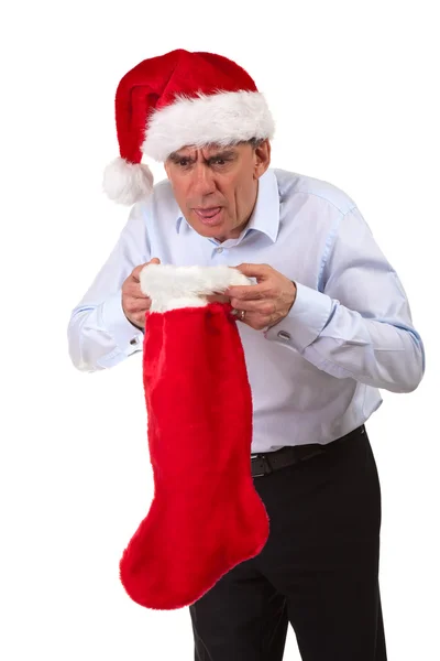 Homem de negócios em Santa Hat jogando para cima no Natal Stocking — Fotografia de Stock