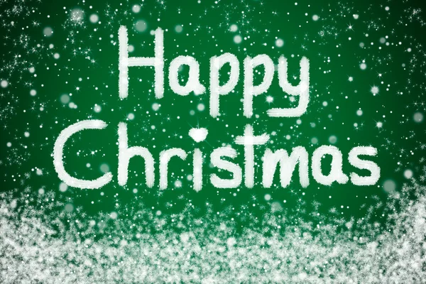 Šťastné vánoční poselství na zeleném pozadí hvězda se sněhem — Stock fotografie