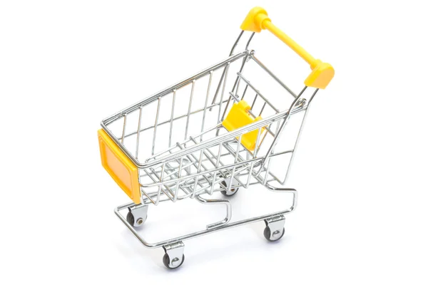 Yellow shopping cart on white — Stock Photo, Image