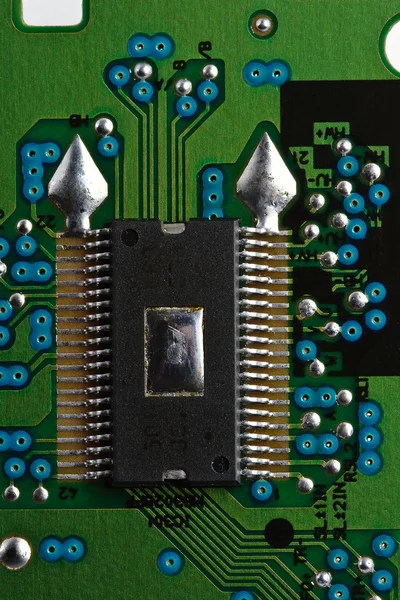 Microchip on green printed circuit board — Stock Photo, Image
