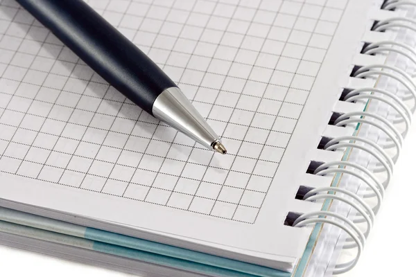 Blue pen with notebook closeup — Stock Photo, Image