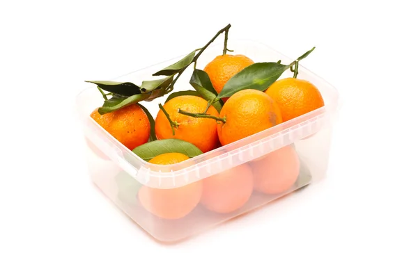 Ripe tangerines in plastic container — Stock Photo, Image