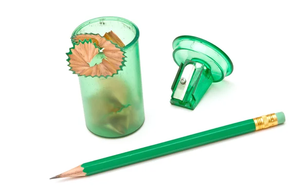 Green sharpener and pencil on white background. — Stock Photo, Image
