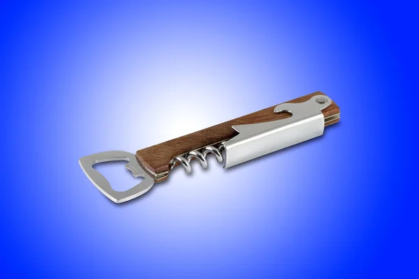 Corkscrew and bottle opener tool, isolated on blue background — Stock Photo, Image