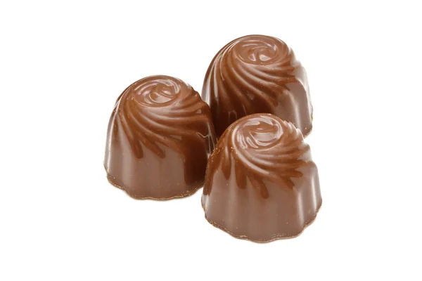 Pralinés de chocolate sobre fondo blanco Imagen De Stock