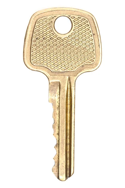 Желтый металлический ключ — стоковое фото