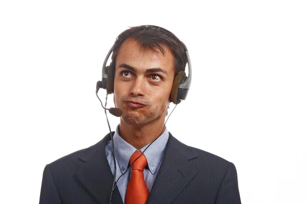 Jonge call center man praat door de telefoon — Stockfoto