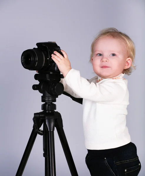 stock image A child with a camera in the studio