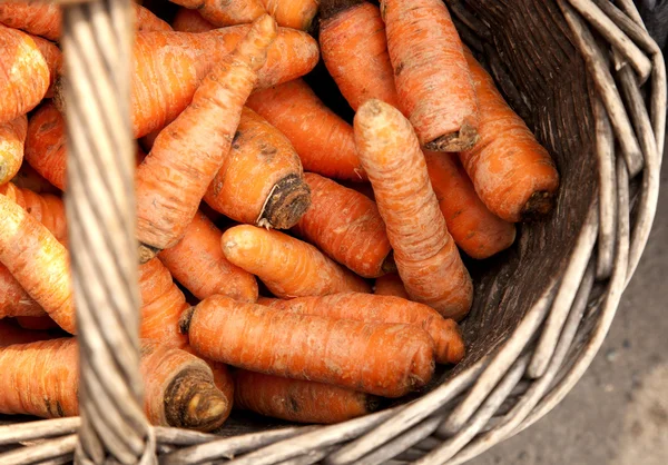Fresh organic carrots in a wooden Stock Photo