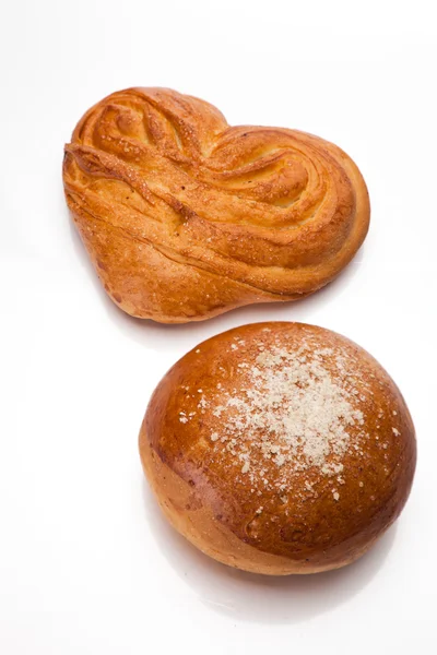 Two sweet buns on white Royalty Free Stock Photos