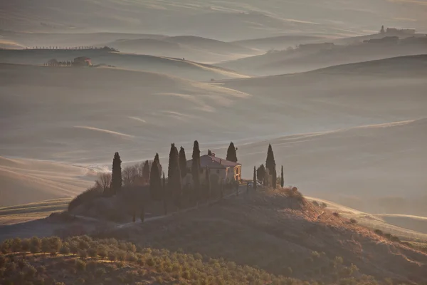 stock image Classic Tuscany landscape with farmhouse and mist