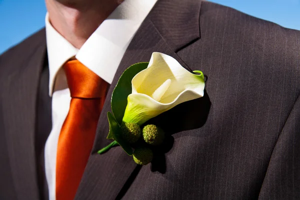 Close up of a lily corsage on a groom — Stock Photo, Image