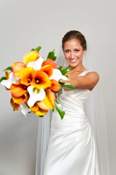 Bride holding her bouquet in front of her — Stock Photo, Image