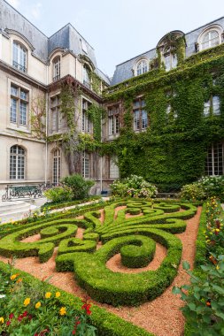 Beautiful ornate gardens of Carnavalet museum clipart
