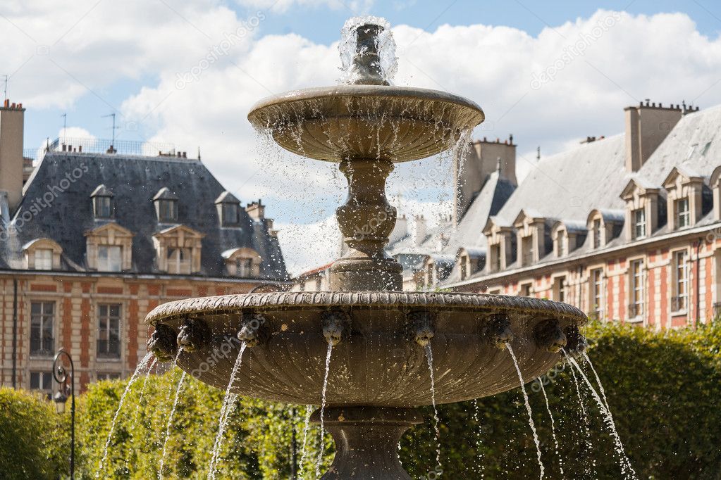 Ornate fountain in Place des Vosges in Paris