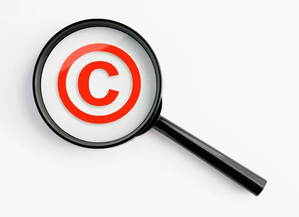 stock image Magnifying glass with copyright symbol