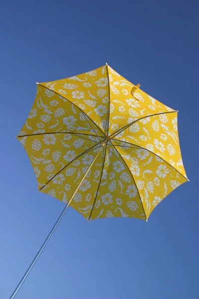 stock image Yellow umbrella in blue sky