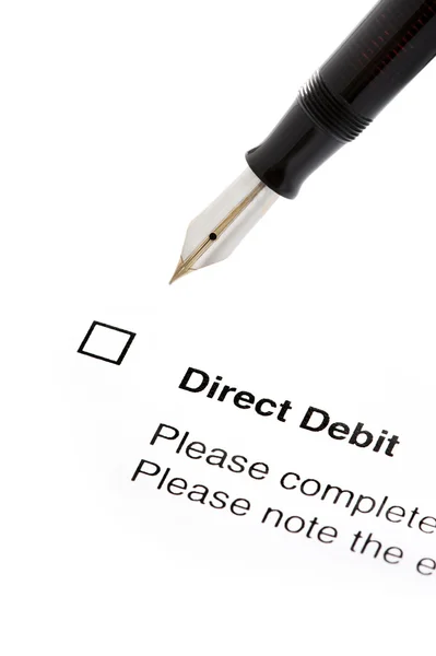 Firma de un formulario de débito directo —  Fotos de Stock