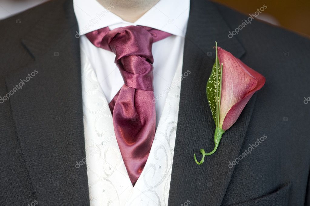 Man with cravat and buttonhole flower