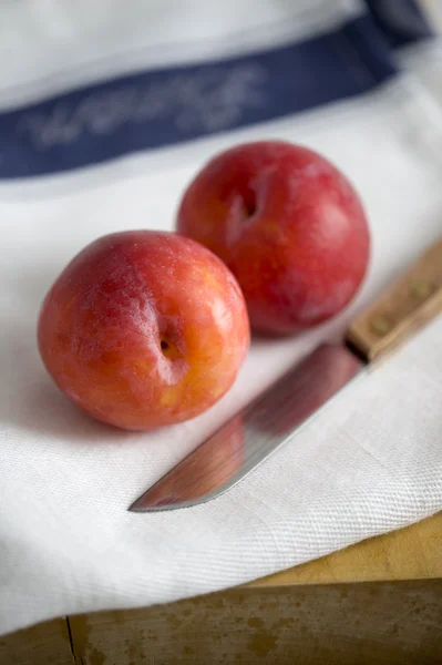 stock image Plums and knife