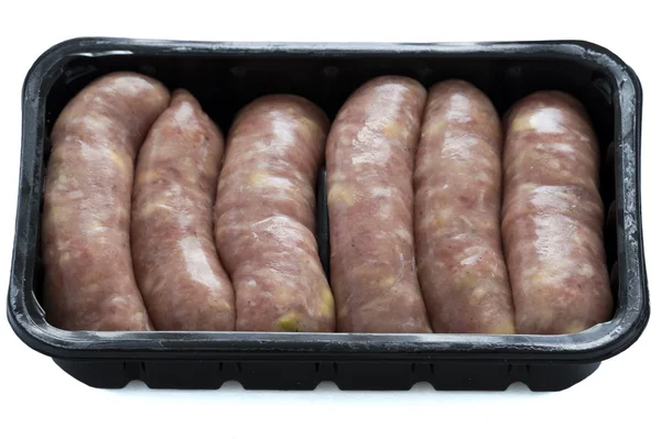 Raw pork and apple sausages in a black plastic tray — Stock Photo, Image