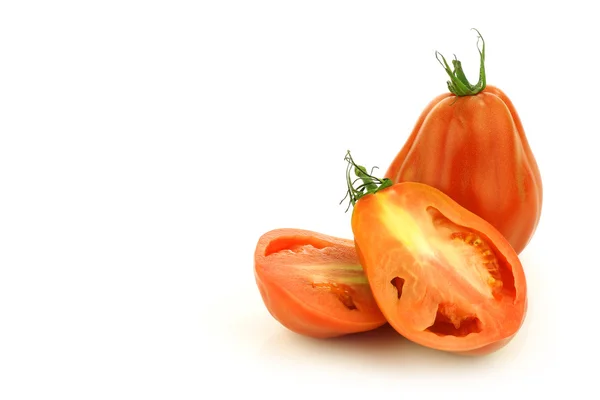 Fresh beef tomato and a cut one — Stock Photo, Image