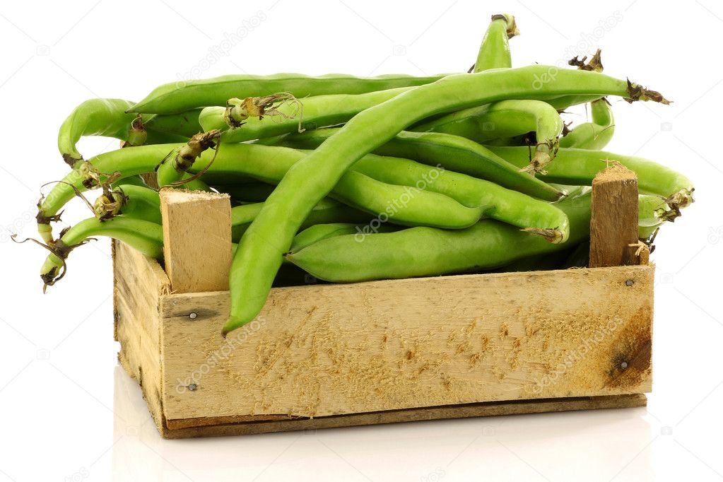 Bunch of broad beans in a wooden box