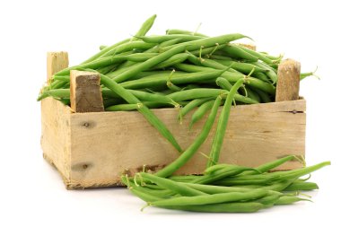 Bunch of green beans in a wooden box