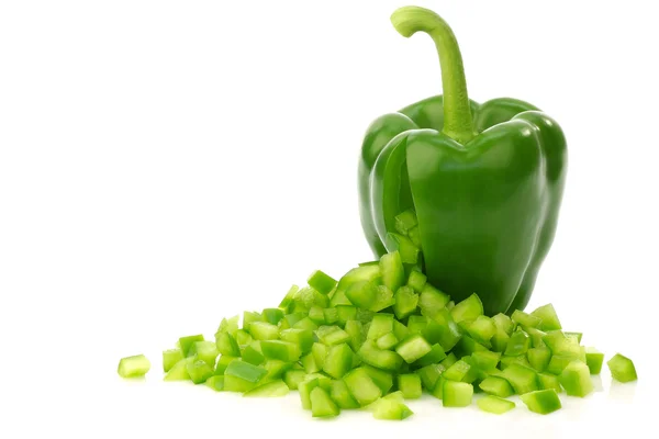 Fresh green bell pepper with pieces of paprika coming out — Stock Photo, Image