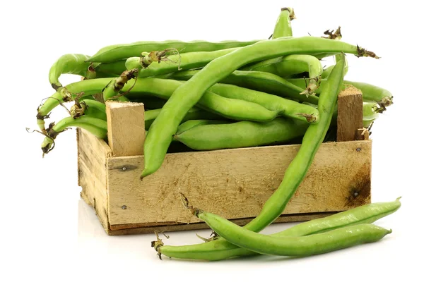Bunch of broad beans in a wooden box — Stock Photo, Image