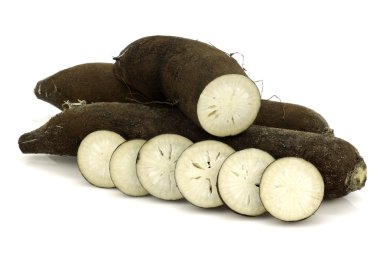 Three long black winter radishes (Raphanus sativus subsp. niger) clipart